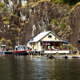 This couple who live off the grid in a floating cabin want to take us on a trip “up the lake”