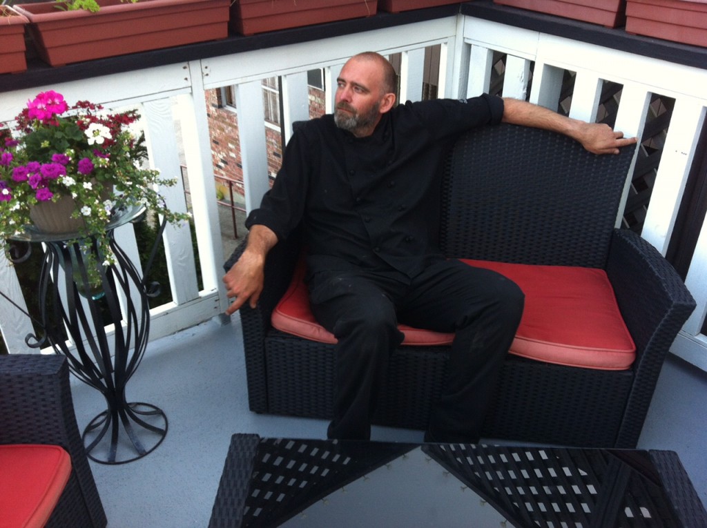 Chef Kelly relaxes on the patio of Edie Rae's