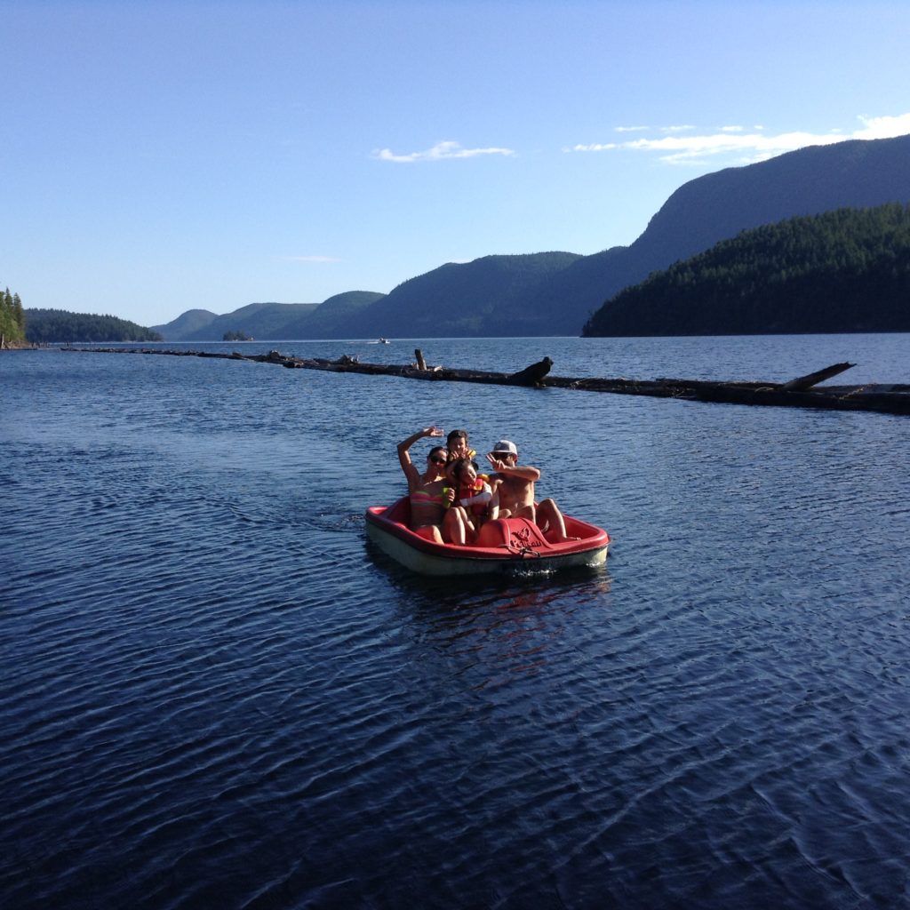 Our grandkids pedal-boating on Powell Lake with their Auntie and Uncle / Photo: Barbara Behan